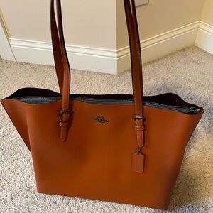 Coach shoulder handbag. Rust color. New with tags.